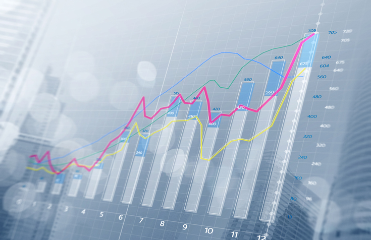 Business growth, progress or success concept. Financial bar chart and growing graphs with depth of field on bright tone background.